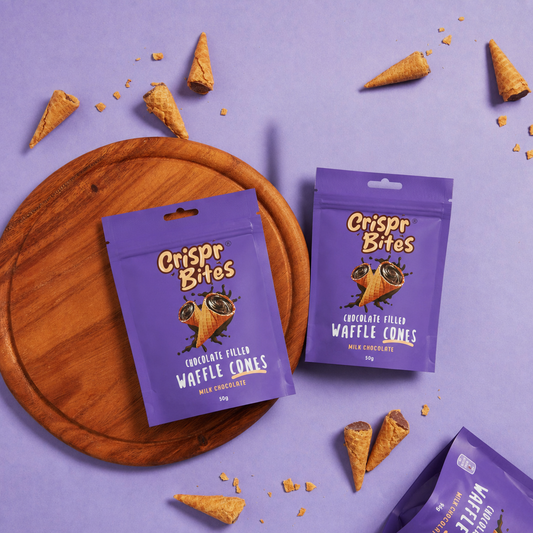 Crispr Bites Minis Milk Chocolate 50g bag lifestyle image